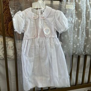 Feltman Brothers smocked dress in packaging with tag